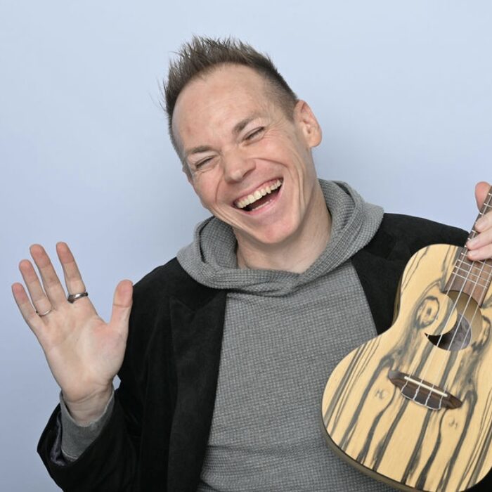 Ryan smiling with ukulele